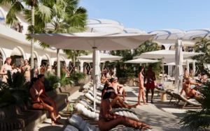 People relaxing at a resort pool.